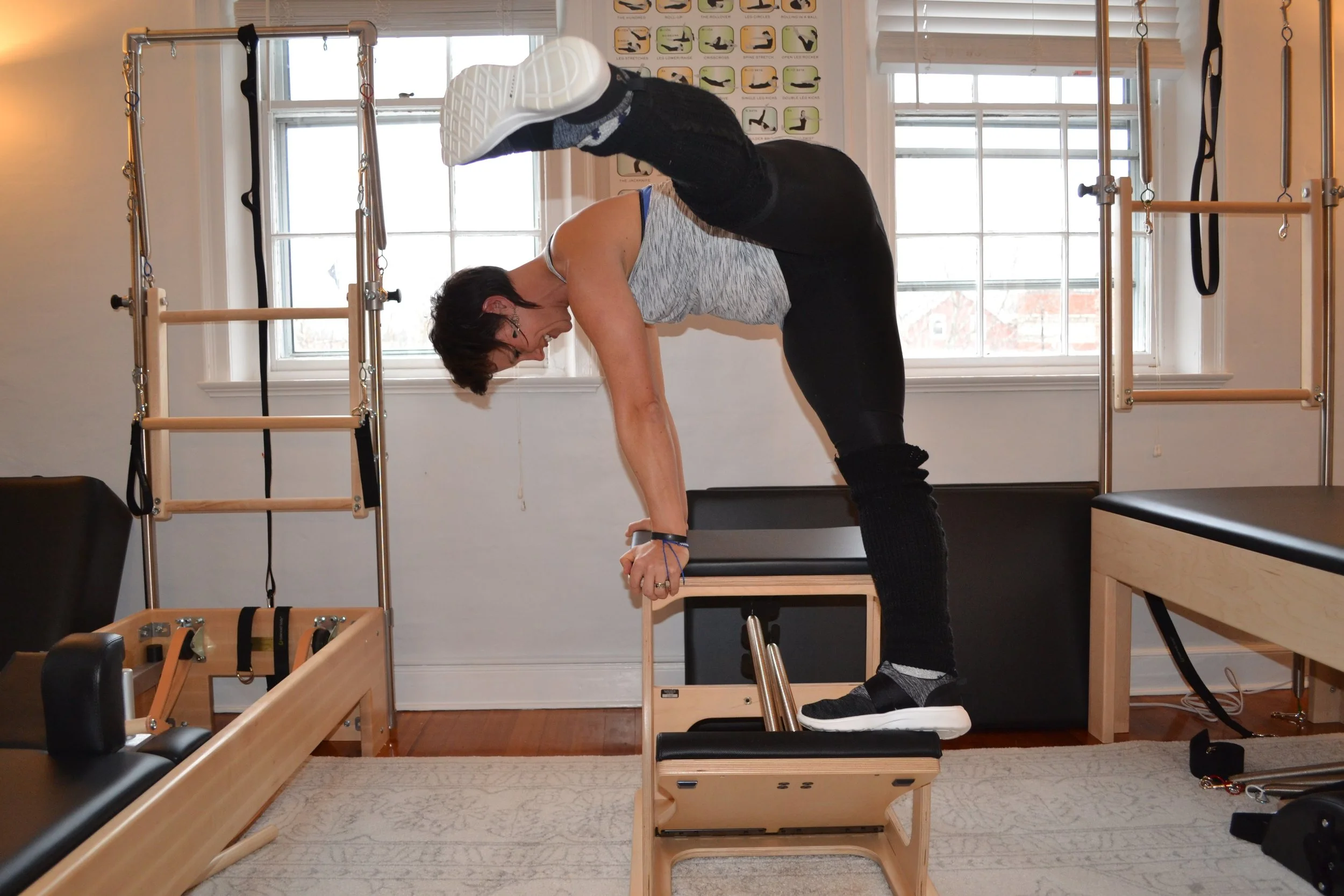 Miriam Lundgren in a supported backbend over the chair