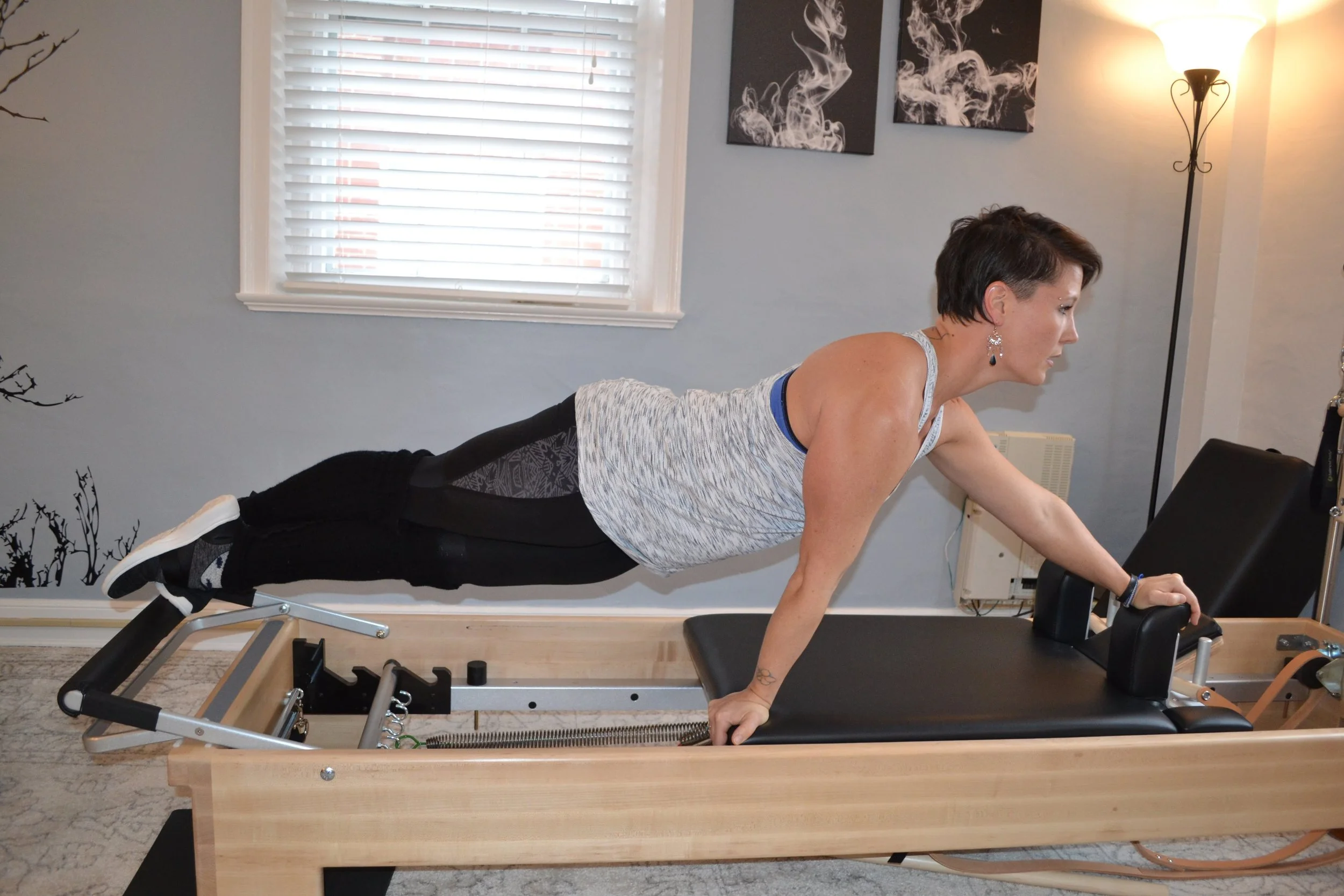 Miriam Lundgren in a long-body plank on the reformer