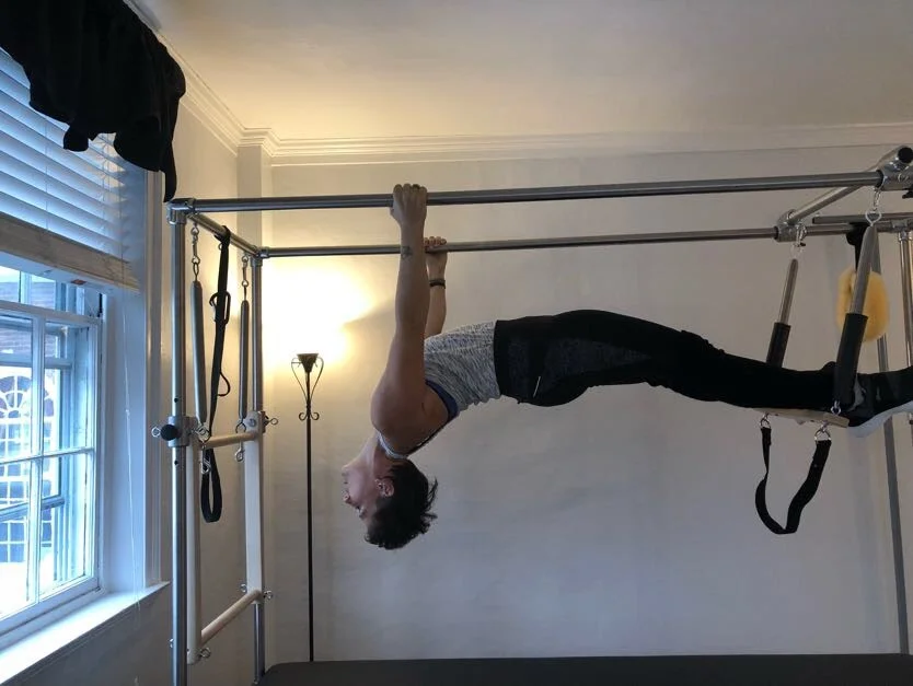 Miriam Lundgren hanging from the tower push-through bar